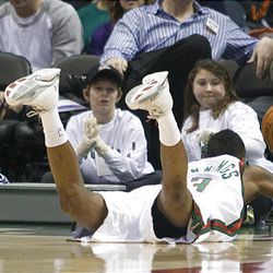 Milwaukee Bucks' Brandon Jennings dives as the ball goes out of bounds during the first half.