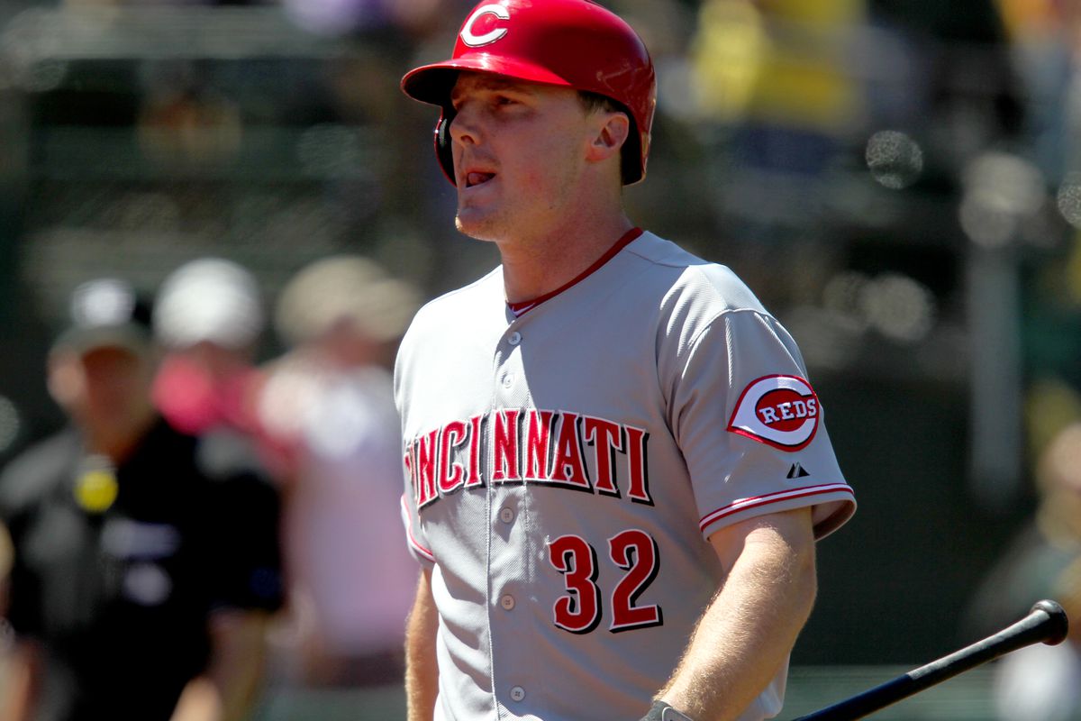 Cincinnati Reds’ Jay Bruce (32) walks off field after striking out to Oakland Athletics pitcher A.J. Griffin (64) in the ninth inning to end their game at O.co Coliseum in Oakland, Calif., Wednesday, June 26, 2013. The Athletics beat the Reds 5-0. (Anda C
