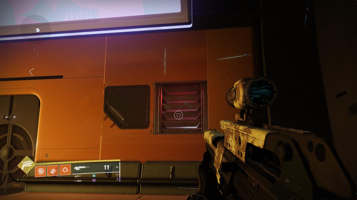 A hunter stares at a vent in the wall of a building in Destiny 2 Lightfall’s new Neomuna expansion.