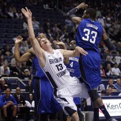 Brigham Young Cougars guard Brock Zylstra (13) shoots by Tennessee State Tigers forward Robert Covington (33) during the season opener in Provo Friday, Nov. 9, 2012.