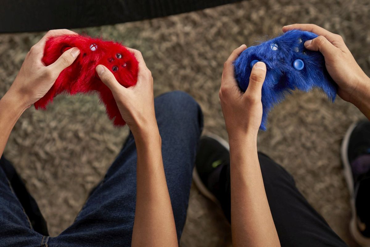 Gamers holding the furry controllers.