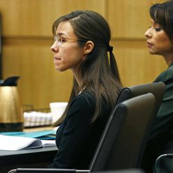Defendant Jodi Arias, center, listens to defense attorney Kirk Nurmi make his closing arguments during her trial on Friday, May 3, 2013 at Maricopa County Superior Court in Phoenix.  Arias is charged with first-degree murder in the stabbing and shooting death of Travis Alexander, 30, in his suburban Phoenix home in June 2008. 