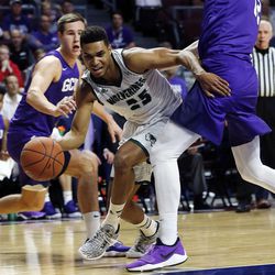 Utah Valley Wolverines guard Kenneth Ogbe dribbles around Roberts Blumbergs of Grand Canyon during the Western Athletic Conference basketball tournament in Las Vegas on Friday, March 9, 2018.