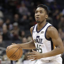 Utah Jazz's Donovan Mitchell (45) brings the ball up the court against the Charlotte Hornets during the first half of an NBA basketball game in Charlotte, N.C., Friday, Jan. 12, 2018. (AP Photo/Chuck Burton)
