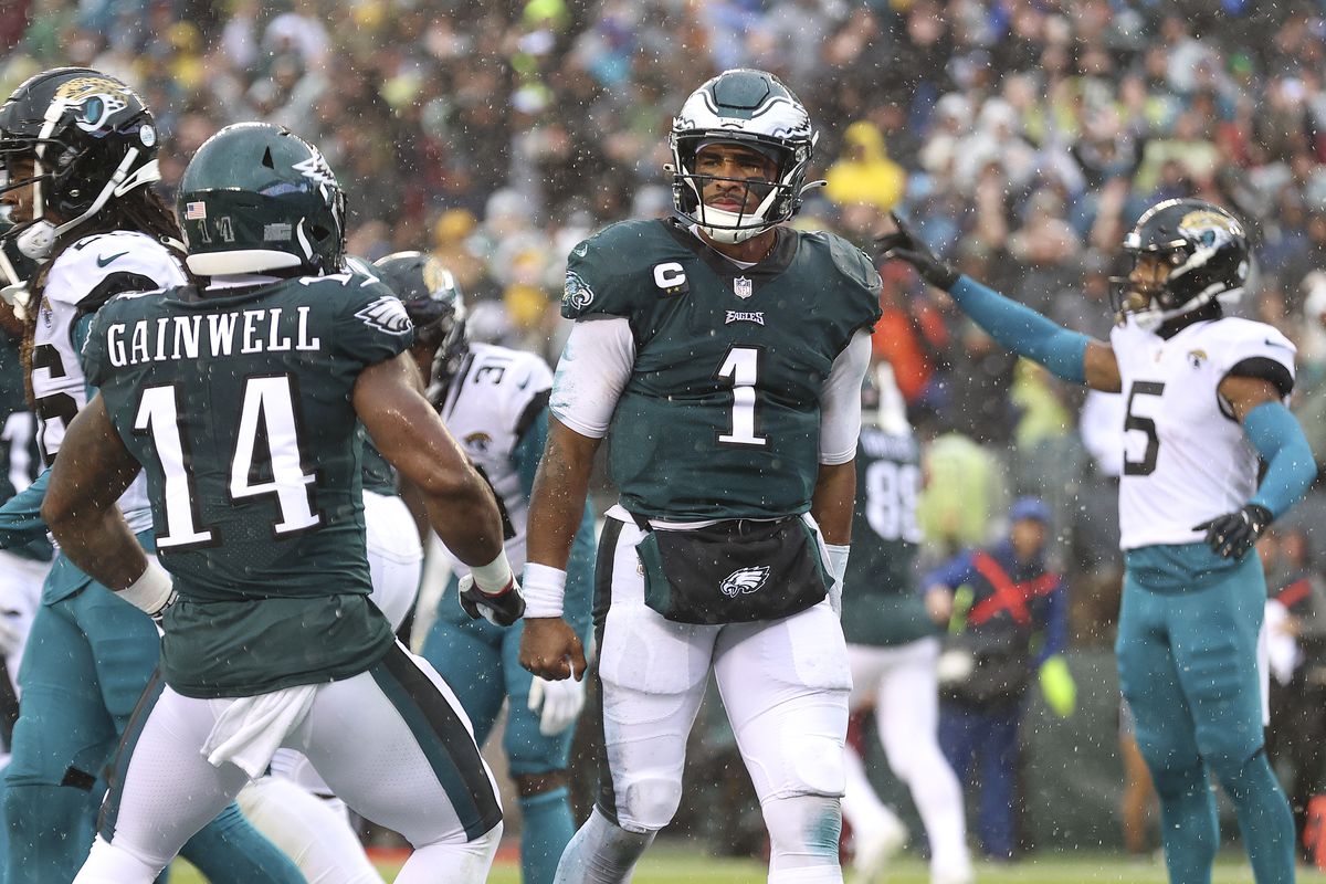 Jalen Hurts #1 of the Philadelphia Eagles (C) celebrates after scoring a touchdown against the Jacksonville Jaguars at Lincoln Financial Field on October 02, 2022 in Philadelphia, Pennsylvania.
