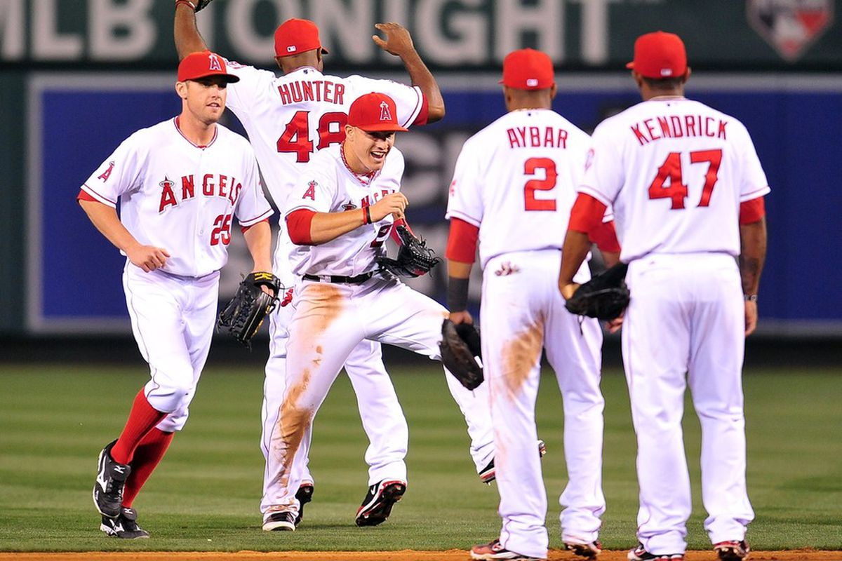 June 1, 2012; Anaheim, CA, USA; Los Angeles Angels center fielder Mike Trout (27) and the Angels celebrate their 4-2 victory against the Texas Rangers at Angel Stadium. Mandatory Credit: Gary A. Vasquez-US PRESSWIRE