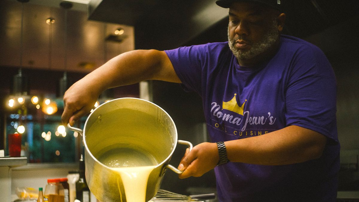 Marquise Cross, the owner of Norma Jean’s Soul Cuisine, prepares mac and cheese for the restaurant.