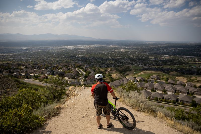 Draper Mayor Troy Walker looks over part of the town while taking journalists on a mountain biking tour of the city’s Corner Canyon trail network on Wednesday, Aug. 25, 2021.