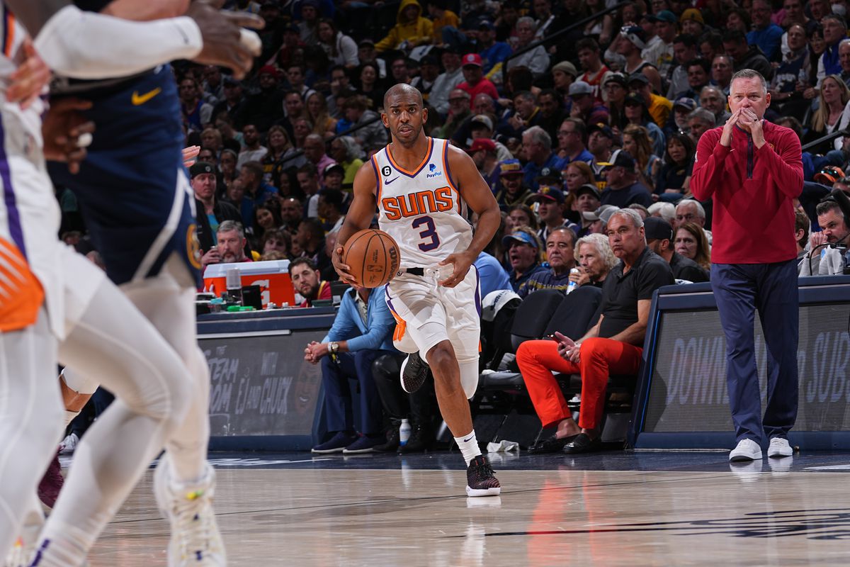 Chris Paul #3 of the Phoenix Suns dribbles the ball against the Denver Nuggets during Round 2 Game 2 of the 2023 NBA Playoffs on May 1, 2023 at the Ball Arena in Denver, Colorado.