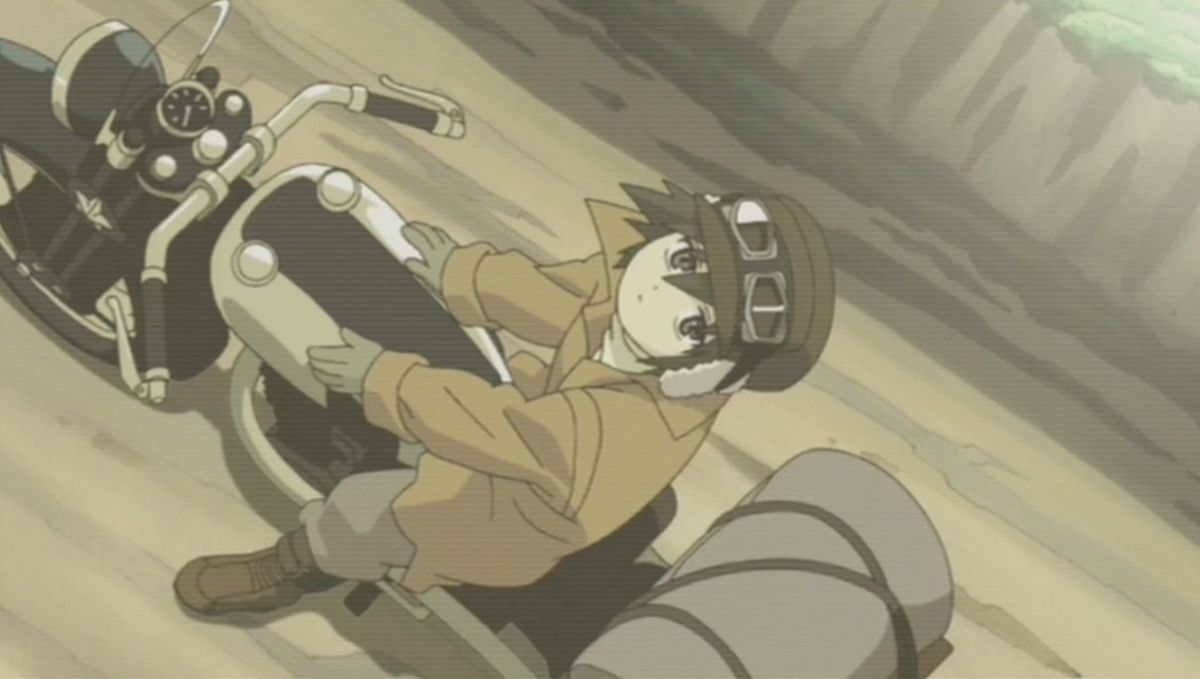 A top-down shot of a brown haired anime child wearing a cap and goggles sitting atop a motorcycle and staring up at the sky.