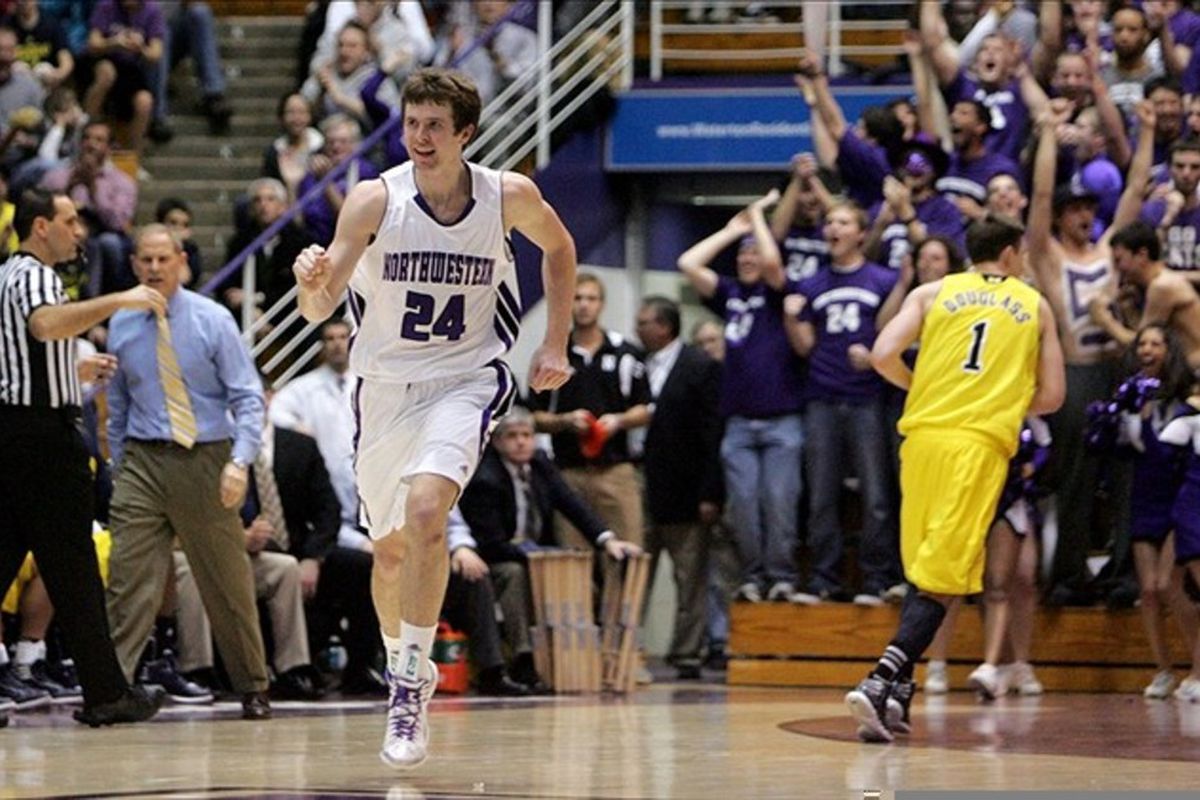 Feb 21, 2012; Evanston, IL, USA; Northwestern Wildcats forward John Shurna (24) reacts after hitting a three-point shot during the first half against the Michigan Wolverines at Welsh-Ryan Arena. Mandatory Credit: Tommy Giglio-US PRESSWIRE