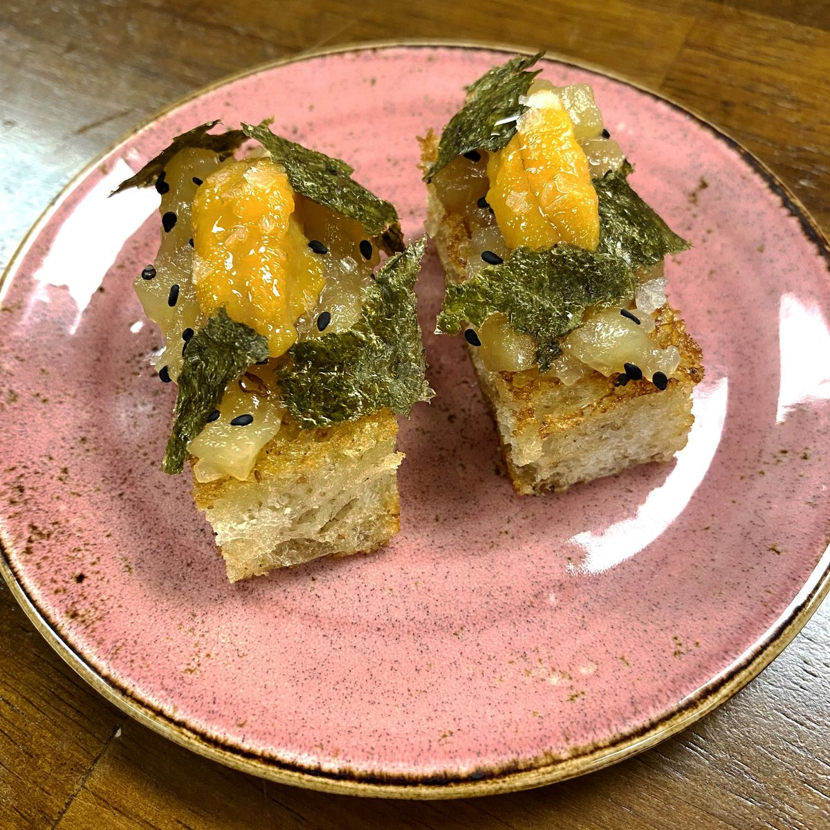Uni toast with green apple marmalade, brown butter soy sourdough bread, sesame seed, nori, and sea salt from Your 3rd Spot in Atlanta. 