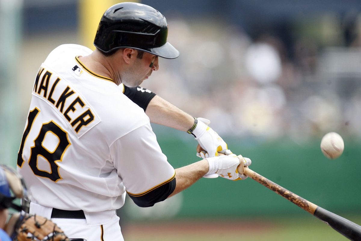 May 23, 2012; Pittsburgh, PA, USA; Pittsburgh Pirates second baseman Neil Walker (18) bats against the New York Mets during the second inning at PNC Park. Mandatory Credit: Charles LeClaire-US PRESSWIRE