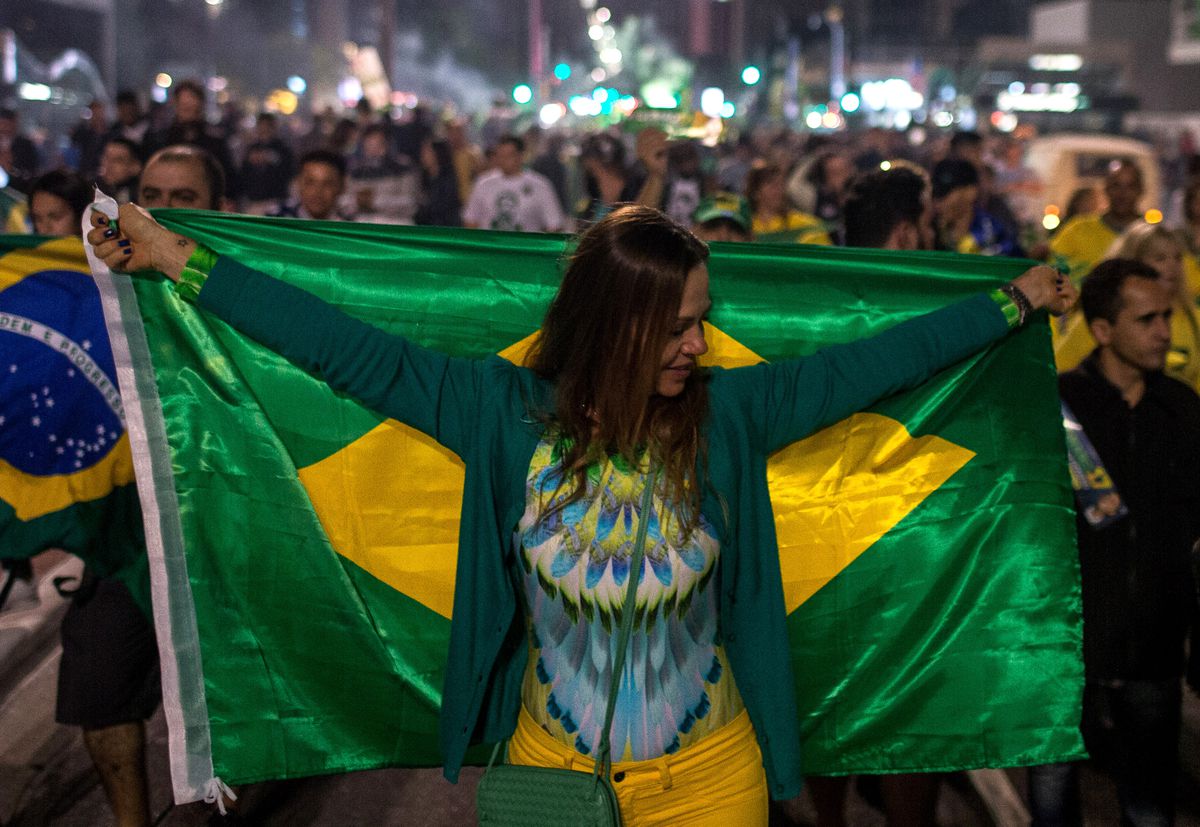 Supporters of right-wing candidate Jair Bolsonaro celebrate victory in the presidential elections on October 28, 2018 in Sao Paulo, Brazil.