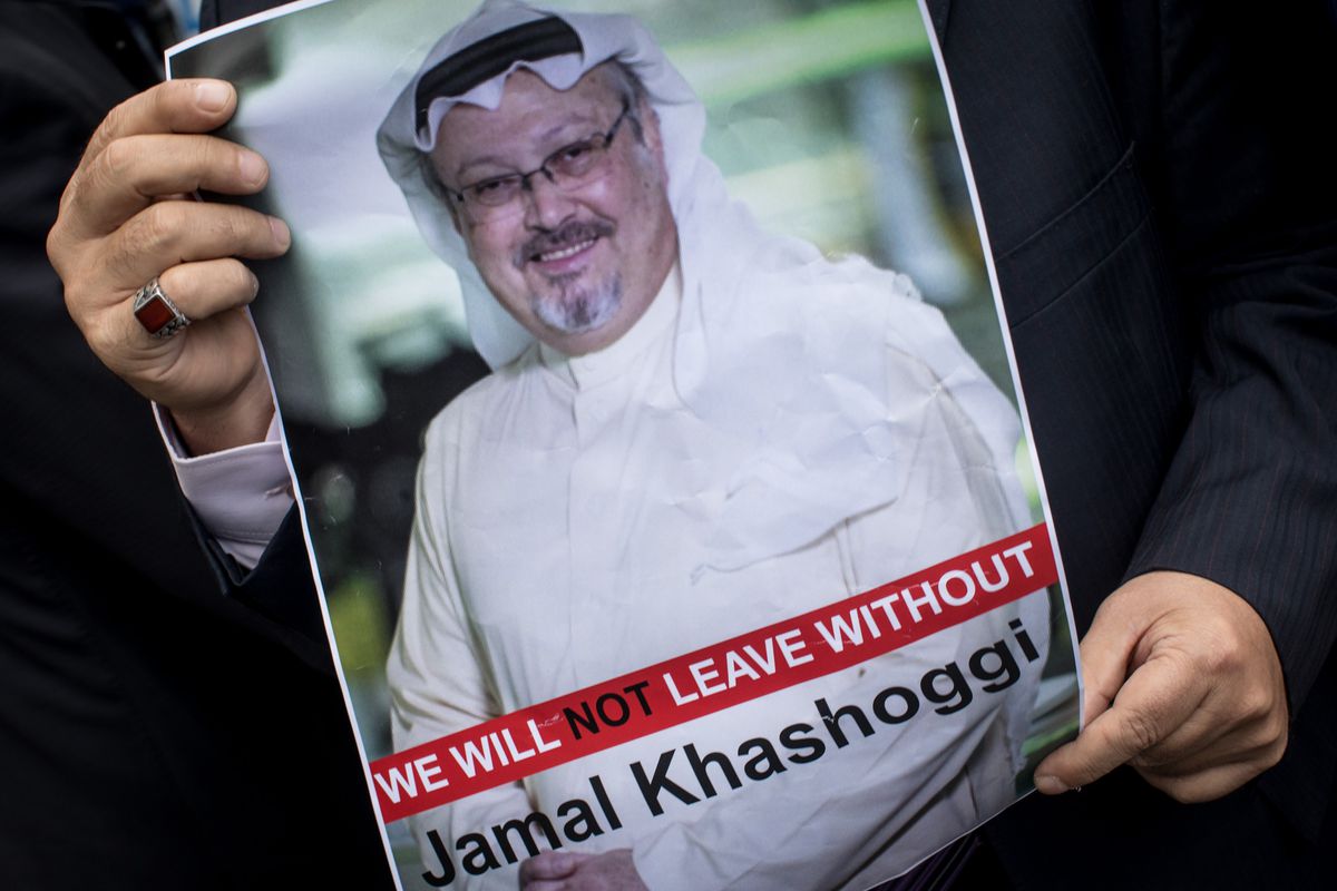 A man holds a poster of slain Saudi journalist Jamal Khashoggi during a protest in Istanbul, Turkey in October 2018.