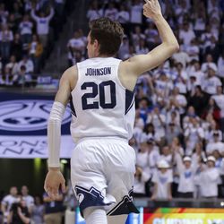Brigham Young Cougars guard Spencer Johnson (20) reacts after shooting a 3-pointer as BYU plays Loyola Marymount in an NCAA basketball game at Marriott Center in Provo on Thursday, Feb. 24, 2022.