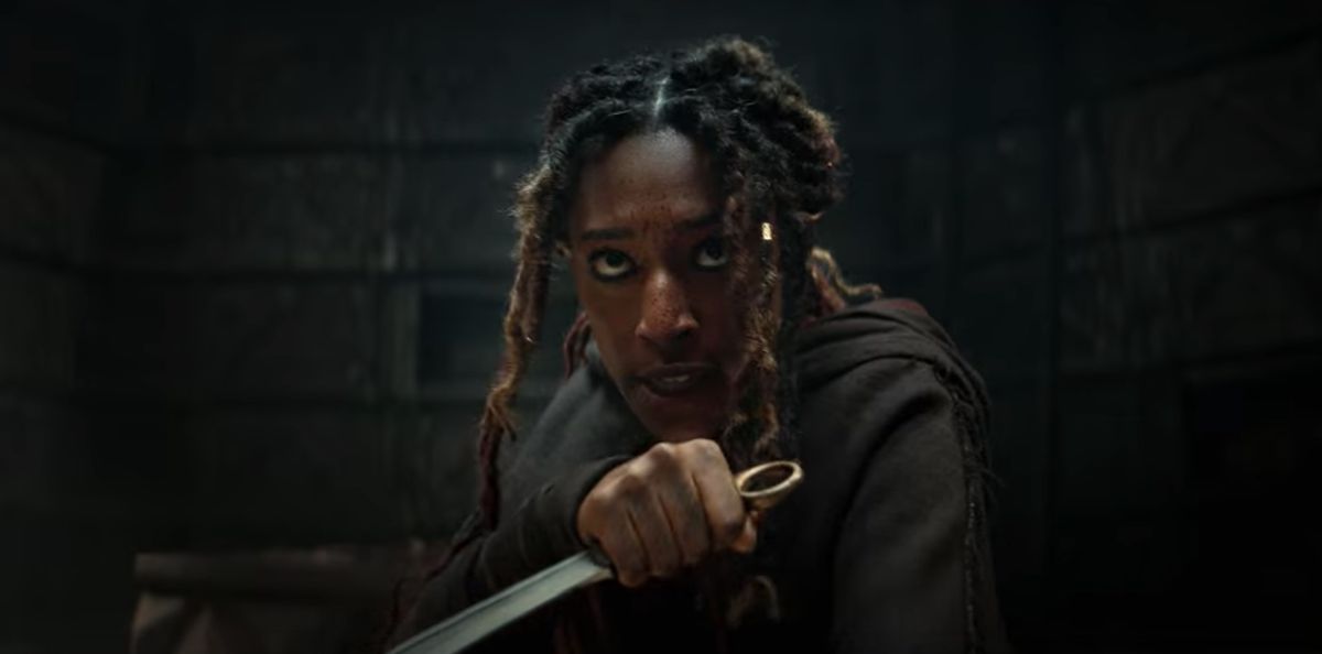 Sophia Brown as Éile holding a dagger in The Witcher: Blood Origin