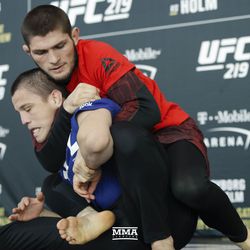 Khabib Nurmagomedov applies a choke at UFC 219 open workouts Thursday at T-Mobile Arena in Las Vegas.