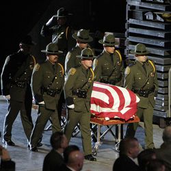 The casket of U.S. Border Patrol agent Nicholas J. Ivie is carried into the UCCU Center at Utah Valley University in Orem, Thursday, Oct. 11, 2012. 