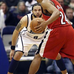 Utah's Deron Williams, left, guards Portland's Andre Miller at EnergySolutions Arena in Salt Lake City on Wednesday. The Jazz beat the Trail Blazers 118-105.