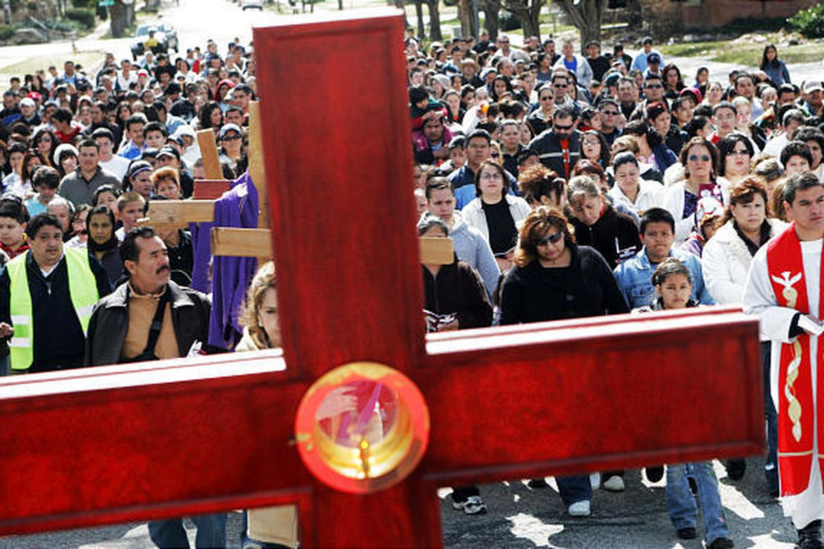 A group of Hispanic Catholics follow a cross as they participate in an Easter march through central Ogden toward the cathedral on 24th street in 2008.