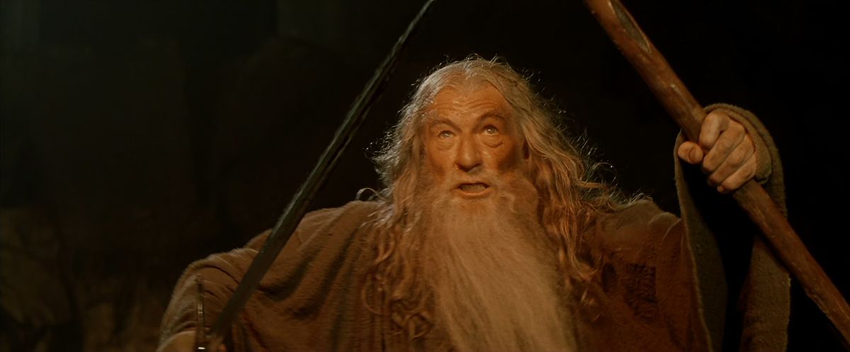 Gandalf brandishes his sword and staff at the Balrog in The Fellowship of the Ring.