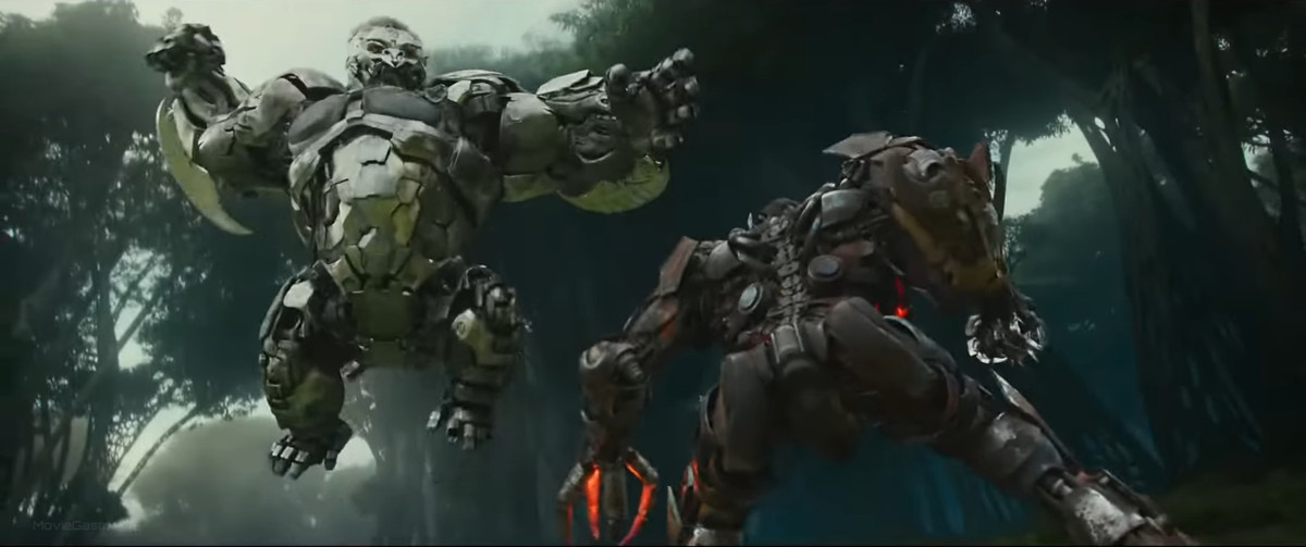 The gorilla-shaped Maximal robot Uplinq leaps high into the air to attack the more humanoid robot Scourge in Transformers: Rise of the Beasts