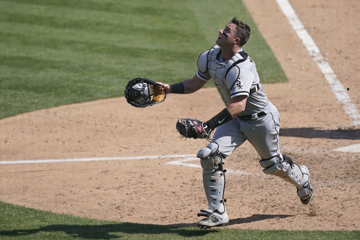 James McCann #33 of the Chicago White Sox tracks a foul pop-up against the Oakland Athletics during the seventh inning of the Wild Card Round Game One at RingCentral Coliseum on September 29, 2020 in Oakland, California.
