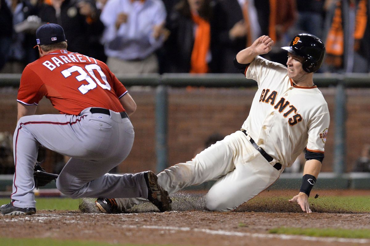 Washington Nationals pitcher Aaron Barrett (30) left, tags San Francisco Giants’ catcher Buster Posey (28) out at home plate in the seventh inning of their National League Division Series at AT&amp;T Park in San Francisco, Calif., on Tuesday, Oct. 7, 2014.(Do
