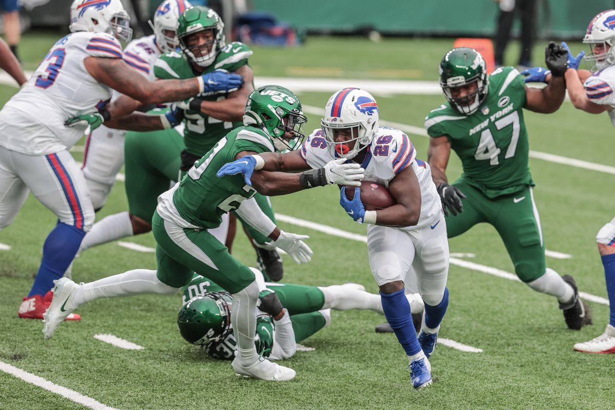 Buffalo Bills running back Devin Singletary (26) carries the ball as New York Jets free safety Marcus Maye (20) tackles during the second half at MetLife Stadium.