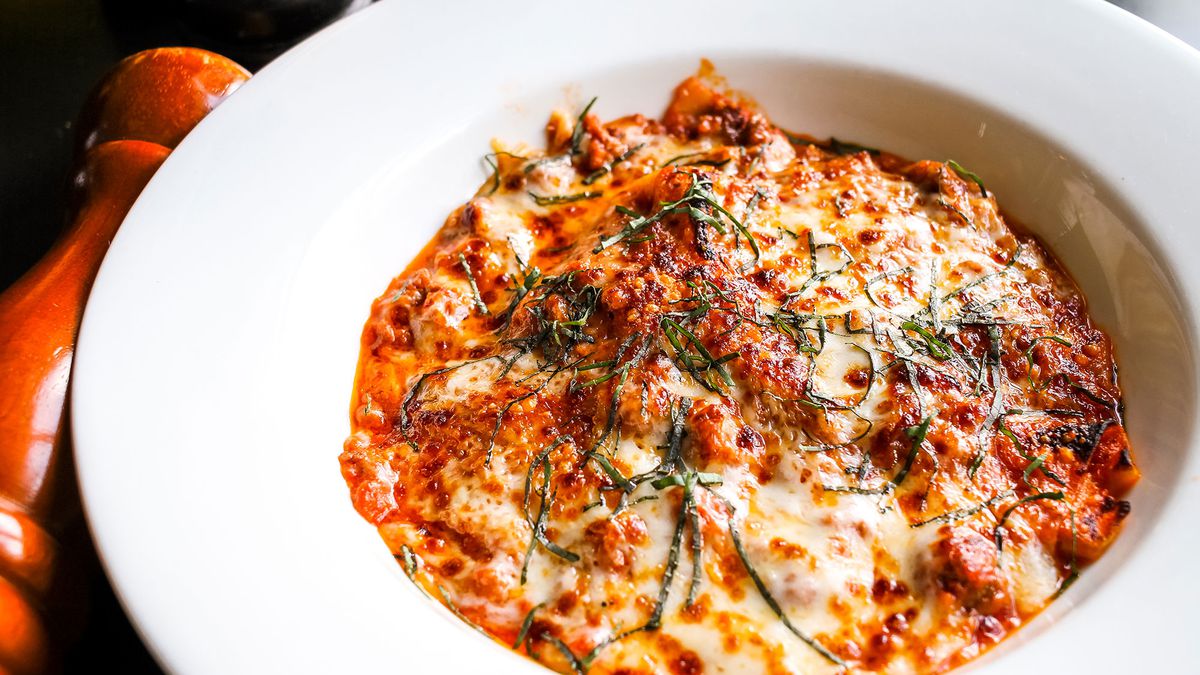 The lasagna matta at Campagnolo in Midtown Atlanta is covered in a thick crust of mozzarella cheese and swimming in tangy red sauce.