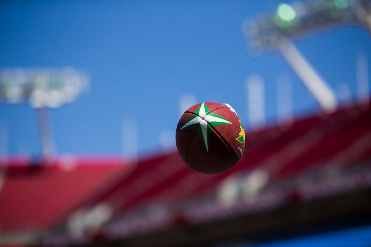 A football with the XFL design spirals through the air during warmups before a game between the Houston Roughnecks and the Tampa Bay Vipers at Raymond James Stadium.
