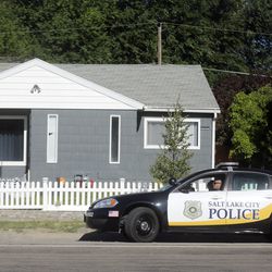 A Salt Lake police car sits outside a house in the Rose Park neighborhood in Salt Lake City on Friday, June 28, 2019. The house was previously searched by police looking for Mackenzie Lueck.