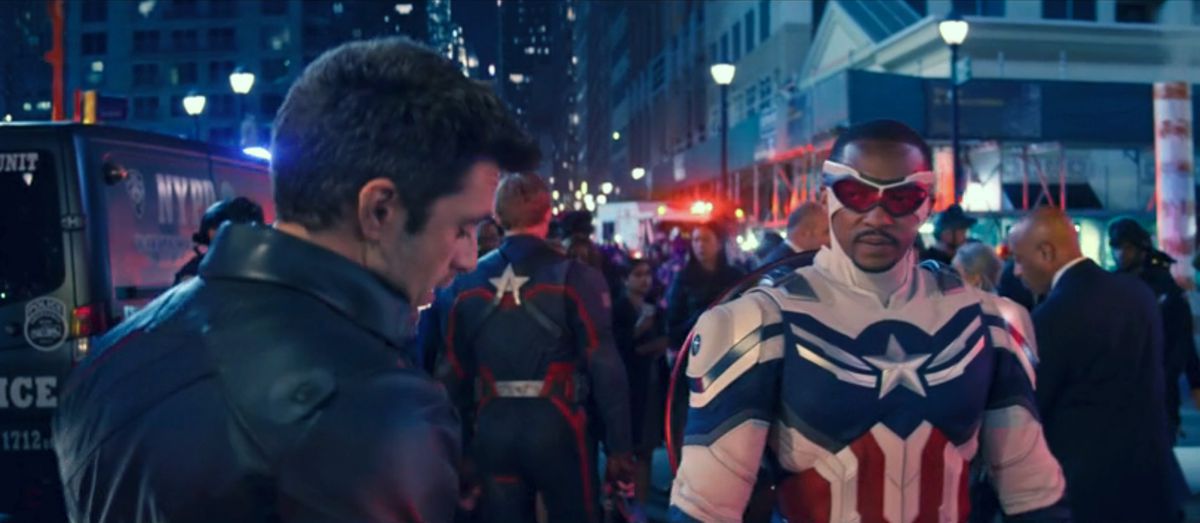 Bucky (Sebastian Stan) and Captain America/Falcon (Anthony Mackie) speak in a crowded NYC city street in a shot from The Falcon and The Winter Soldier