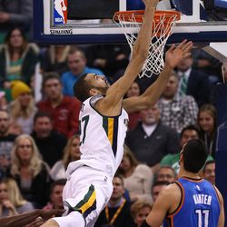 Utah Jazz center Rudy Gobert (27) flips up a shot over Oklahoma City Thunder center Enes Kanter (11) as the Jazz and the Thunder play at Vivint Smart Home arena in Salt Lake City on Wednesday, Dec. 14, 2016.