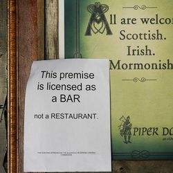 A bar sign approved by the Alcoholic Beverage Control Commission is posted at Piper Down in Salt Lake City on Tuesday, May 9, 2017.