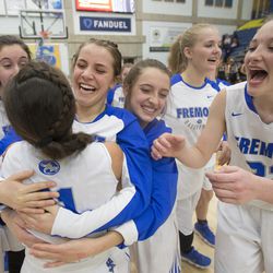 Fremont teammates celebrate following their 48-46 win over Riverton in the Class 6A state quarterfinals at Salt Lake Community College in Taylorsville on Thursday, Feb. 22, 2018.
