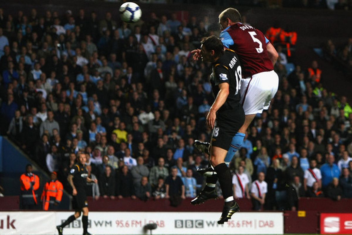 Richard Dunne climbs atop Gareth Barry in the battle for glory against a former club. Dunney wins and scores the opener at Villa Park, although the match ultimately ends in a 1-1 draw.
(October 4, 2009 - Photo by Clive Rose/Getty Images Europe) 