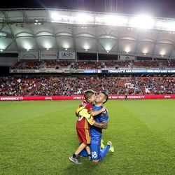 Real Salt Lake goalkeeper Nick Rimando (18) celebrates with his son, Jett Nicholas Rimando, after RSL's win over Chicago Fire makes him Major League Soccer's all-time leader in goalkeeper victories at Rio Tinto Stadium in Sandy on Saturday, Aug. 6, 2016.
