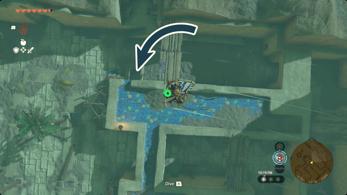 The Legend of Zelda: Tears of the Kingdom Link paragliding over Gerudo Town with the entrance to the cave below Fashion Passion marked.