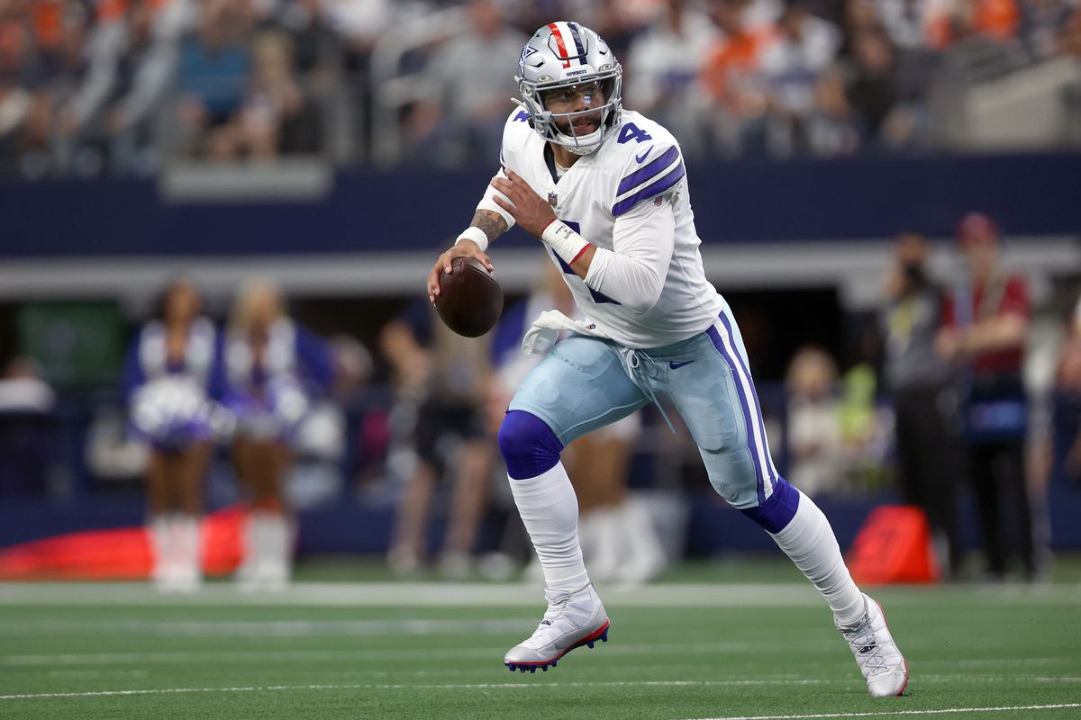 Dak Prescott #4 of the Dallas Cowboys scrambles with the ball during the first quarter against the Denver Broncos at AT&amp;T Stadium on November 07, 2021 in Arlington, Texas