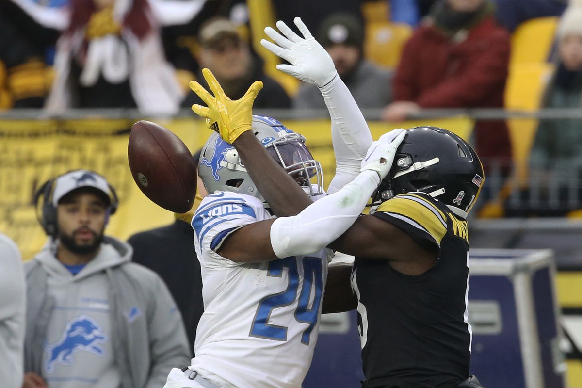 Detroit Lions cornerback Amani Oruwariye (24) commits pass interference against Pittsburgh Steelers wide receiver James Washington (13) during the first quarter at Heinz Field.