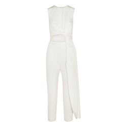 There’s nothing we love more than a one-and-done silhouette, especially on our wedding day. This Roksanda jumpsuit gives you pre-layered shapes, knotted embellishments, and cutout accents without requiring you to fuss with a single sash.