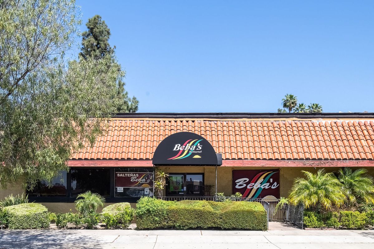 An Orange County restaurant with tiled roof shown from the outside at daytime.