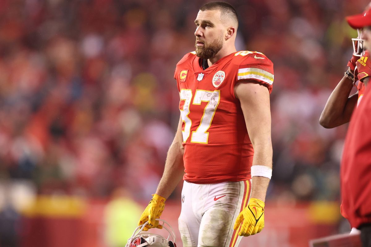Travis Kelce of the Kansas City Chiefs stands on the field during an AFC Divisional Round playoff game against the Jacksonville Jaguars at GEHA Field at Arrowhead Stadium on January 21, 2023 in Kansas City, Missouri.