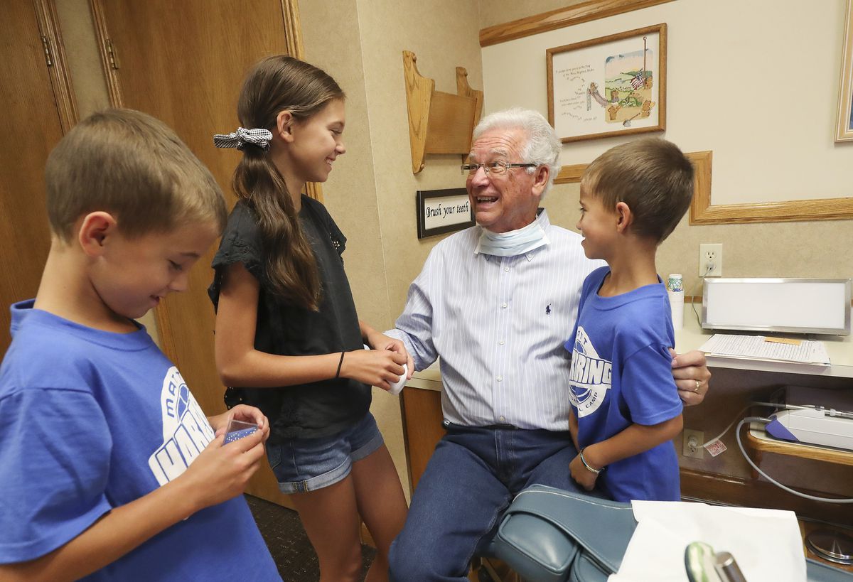 Dr. Chris Simonsen talks with patients Carter, Ellie and Beckham Easton after their examinations in Bountiful on Wednesday, July 31, 2019. Simonsen started his pediatric dentistry practice 50 years ago.