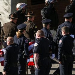 The body of Utah Highway Patrol Trooper Eric Ellsworth is transported to the State Medical Examiner's Officer in Salt Lake City on Friday, Nov. 25, 2016.