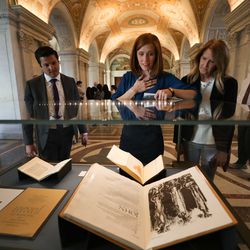 Jennie Taylor, widow of former North Ogden mayor and major in the U.S. Army National Guard Brent Taylor who was killed in Afghanistan in November 2018, looks at a display of the Book of John during a tour of the Library of Congress in Washington, D.C., on Feb. 6, 2019. She is accompanied by a Rep. Rob Bishop, R-Utah, staff member, Devin Wiser, left, and Brent's parents Tamara and Stephen Taylor, right.