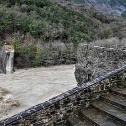 The remains of the 18th-century Plaka bridge destroyed by flooding, are seen over Arachthos river in the village of Plaka Raftanaion in the Epirus region, northwestern Greece, on Sunday, Feb. 1, 2015. Flash floods caused by heavy rains have submerged large areas in northwestern Greece, forcing authorities to evacuate several villages in the Epirus region. Greece's Prime Minister Alexis Tsipras said he was "very sad" to hear of Plaka bridge's collapse and has urged experts to go to the flooded area and inspect roads and monuments there.