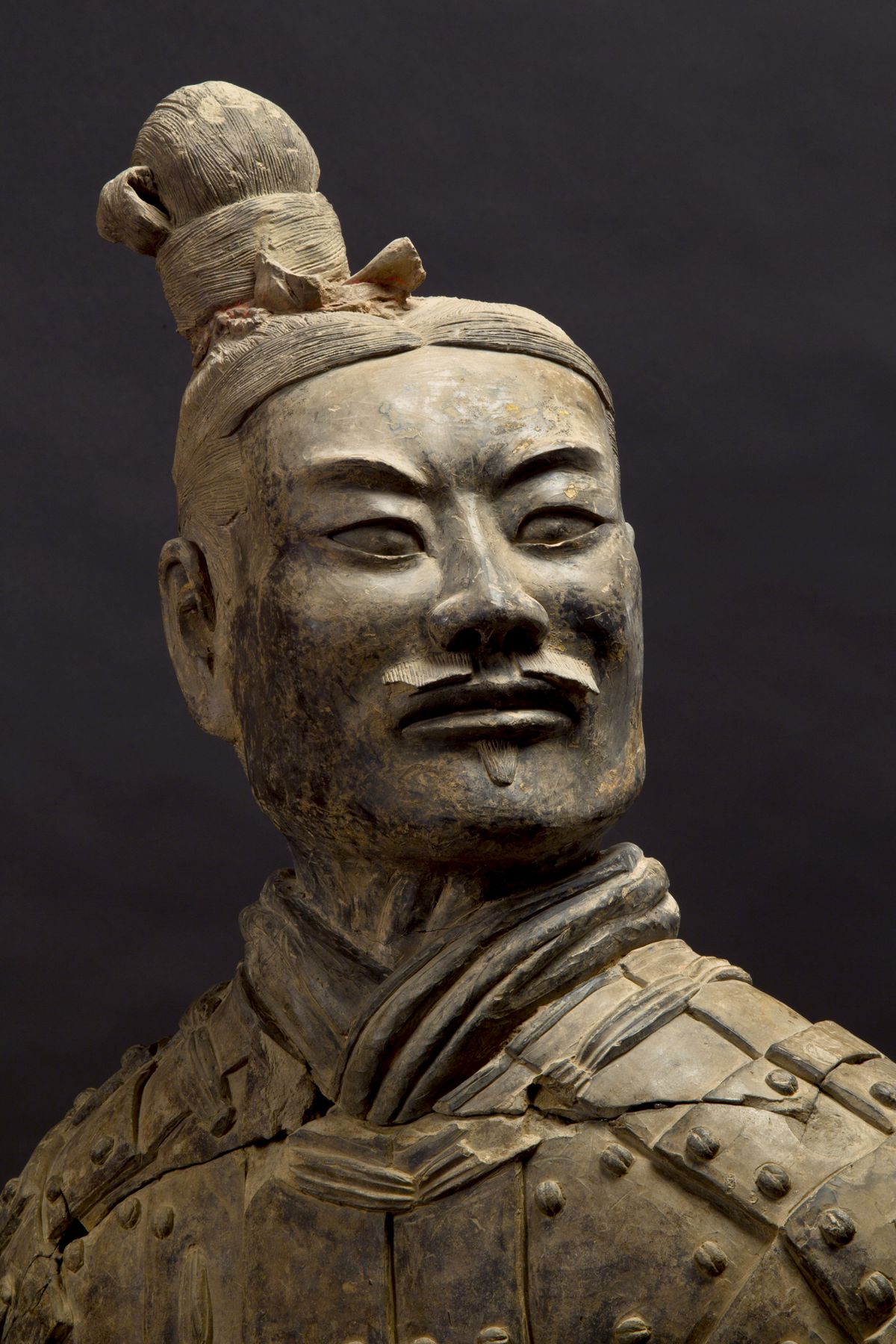 China: Detail of a warrior, Head and Chest, from the terracotta army guarding the tomb of Qin Shi Huang, first emperor of a unified China (r. 246-221 BCE), Xi’an